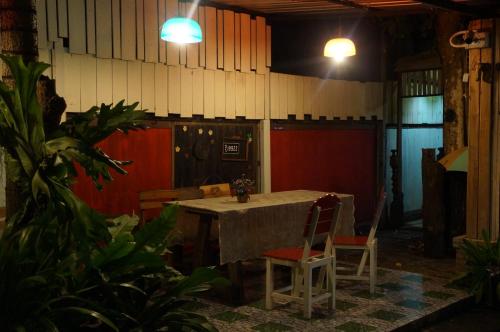a dining room with a table and two chairs at Tanyahouse in Chiang Rai