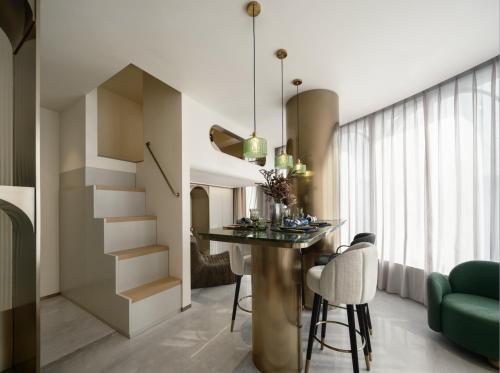 a kitchen with a table and chairs in a room at North Bund 681 in Shanghai