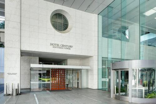 a building with a red door in front of it at Odakyu Hotel Century Southern Tower in Tokyo