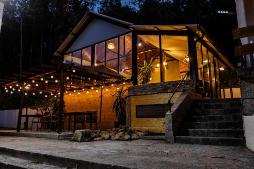 a house with lights on the side of it at River Rest in Vetren