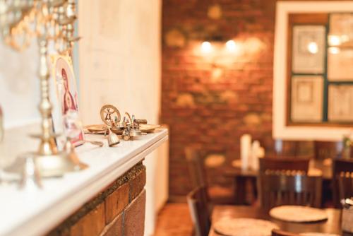 a kitchen with a sink and a counter in a restaurant at Sfizioso Boutique Stay Brasov - Free Parking in Braşov