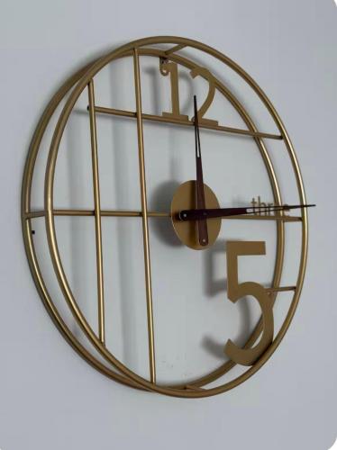 a large gold clock with a dollar sign on it at Cute Apartment at city center in Tirana