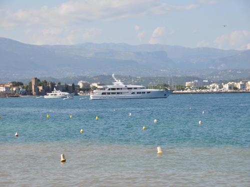 a large white boat in a large body of water at Modern Villa with Pool in Montauroux France in Montauroux