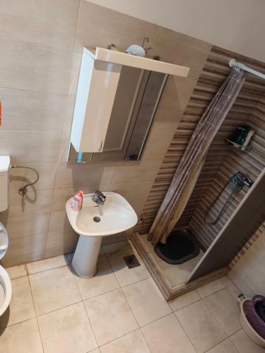 a bathroom with a sink and a mirror at TARAS Hostel in Belgrade