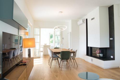 a kitchen and dining room with a table and chairs at Hidden Gem - Villa with private swimmingpool Bellagio view in Lierna