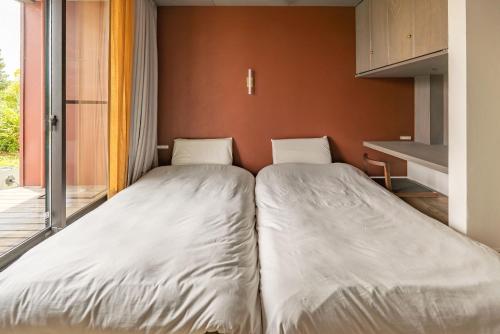 En eller flere senge i et værelse på Dei Amami - Vacation STAY 28894v