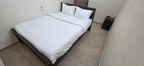 Katil atau katil-katil dalam bilik di Heart of Pondy Service Apartment