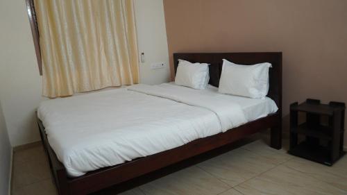Katil atau katil-katil dalam bilik di Heart of Pondy Service Apartment