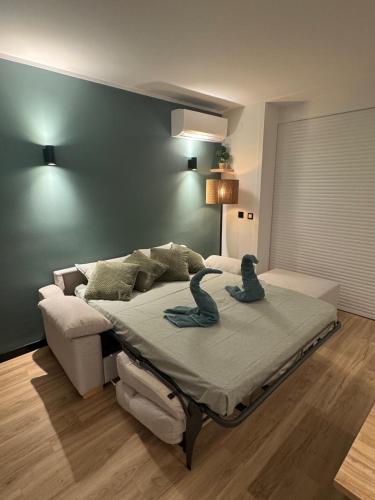 a bedroom with a bed with two birds on it at Marina View II Empuriabrava - view port in Empuriabrava
