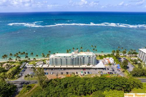 an aerial view of a hotel and the ocean at Beachfront Condo with Ocean View in Hauula