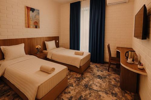 Katil atau katil-katil dalam bilik di Siab Boutique Hotel