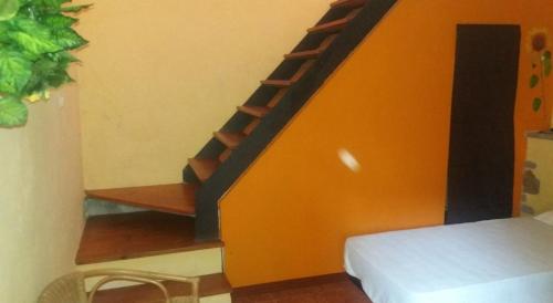 a room with a staircase and a bed in a room at appartamento luxury lavitabella in centro in La Spezia