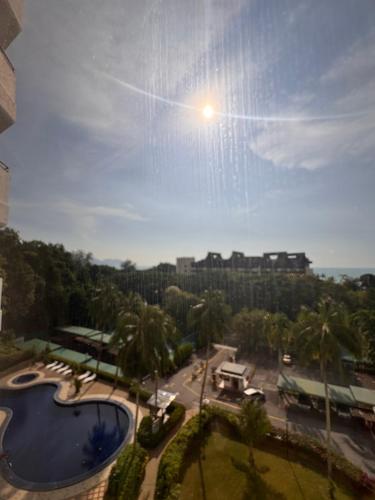 a view of a swimming pool in a city at Sri Sayang sunset 2 bedroom in Batu Ferringhi