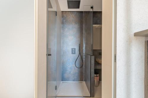 a shower with a glass door in a bathroom at Bed & Mare by Perle di Puglia in Baia Di Gallipoli