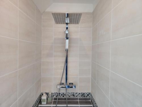 a bathroom with a shower with a sink at Les Quatre Baies in Guichen