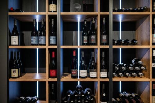 a wine cellar filled with lots of bottles of wine at Alpenwellnesshotel St. Veit in Sesto