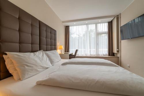 Postel nebo postele na pokoji v ubytování Pakat Residences