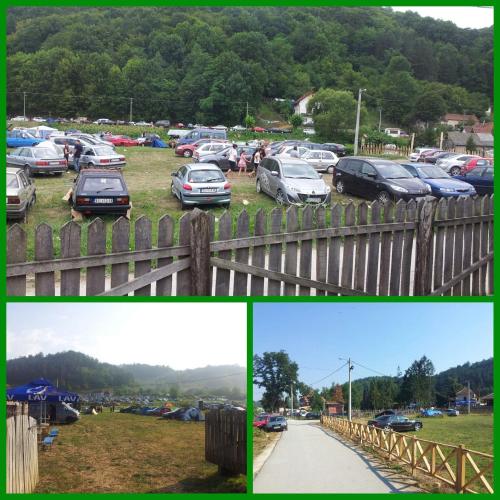 a group of cars parked in a parking lot at Etno konačište Protić, Guča in Guča