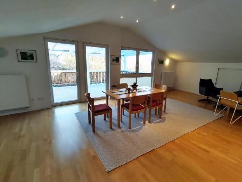 a dining room with a table and chairs at Ferienwohnung im Müritz Nationalpark in Mirow in Mirow