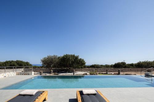 Бассейн в Pelagria Villa, a 4-Acre Escape with Beach Access, By ThinkVilla или поблизости