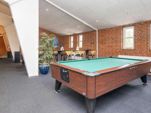 a pool table in the middle of a room at Ho Holiday Center in Blåvand