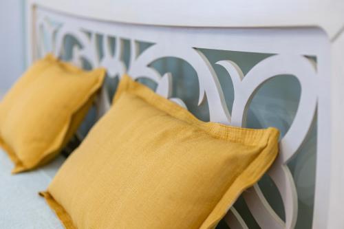 two pillows sitting on top of a table at Gma Home Primo Piano in Pulsano