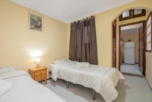 Ένα ή περισσότερα κρεβάτια σε δωμάτιο στο Casa Salma 2