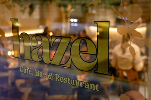 a sign for a bar and restaurant in a window at AC Hotel by Marriott Glasgow in Glasgow