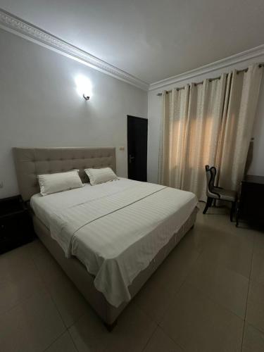 Giường trong phòng chung tại Residence NOVA