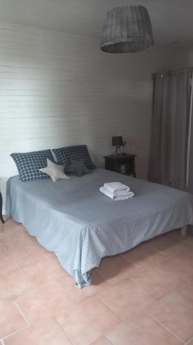 Ένα ή περισσότερα κρεβάτια σε δωμάτιο στο Chambres d'hôtes Lamourio