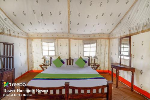 a bedroom with a bed in a room at Treebo Desert Harmony Camp in Sām