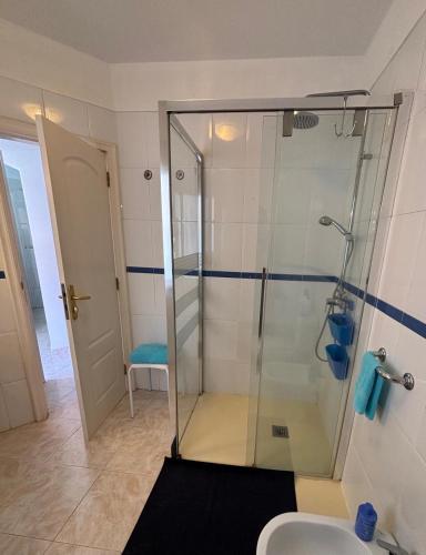a bathroom with a glass shower with a toilet at Veliero en Costa Sol M13 in Costa Del Silencio