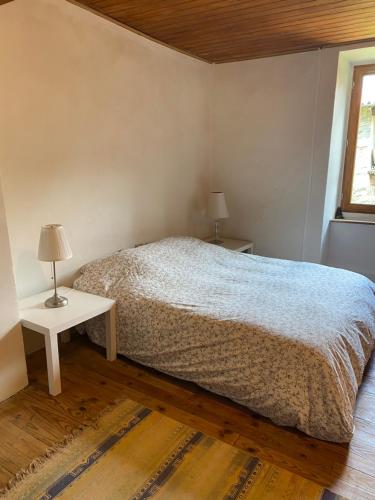 Cama o camas de una habitación en Gîte de la Condamine