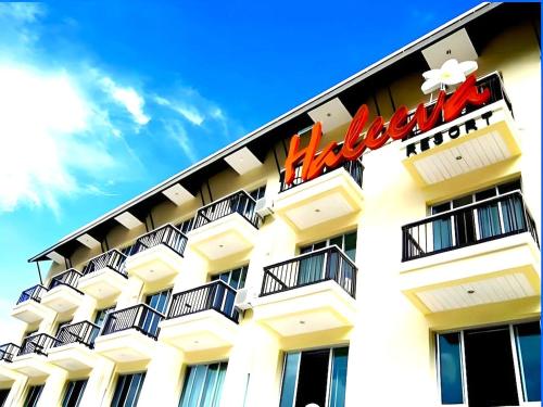 a hotel with a sign on the side of it at The Haleeva Aonang in Ao Nang Beach