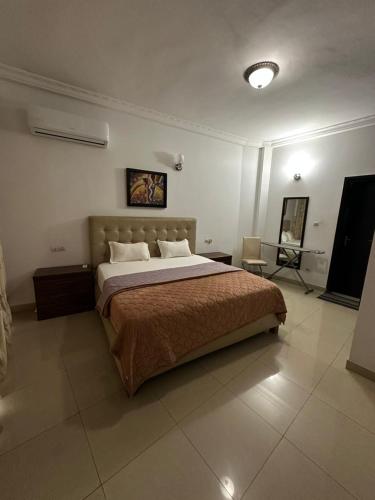 Giường trong phòng chung tại Residence NOVA