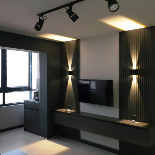 a room with a flat screen tv and a large window at Апартамент с една спалня в ценъра на града in Yambol