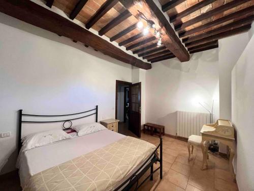 En eller flere senge i et værelse på PoloTuristicoUmbria Residence al Lago con Piscina