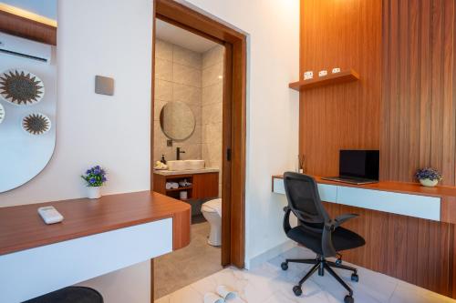 a office with a desk and a chair in a room at 3BR Brand New Cozy Private Villa D'Pondok Balangan in Uluwatu