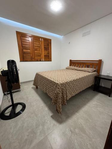 Ένα ή περισσότερα κρεβάτια σε δωμάτιο στο Casa Alvorada