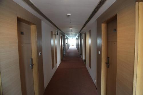 a hallway in a building with a long corridor at IRA By Orchid Bhubaneswar in Bhubaneshwar