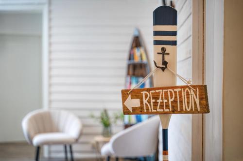 a sign on a door that reads regeneration at Hotel Strandschlösschen in Travemünde
