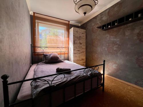 Postel nebo postele na pokoji v ubytování Great Forest Family Apartment