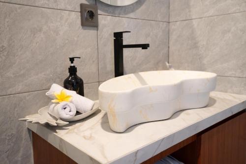 a bathroom sink sitting on a counter in a bathroom at 3BR Brand New Cozy Private Villa D'Pondok Balangan in Uluwatu
