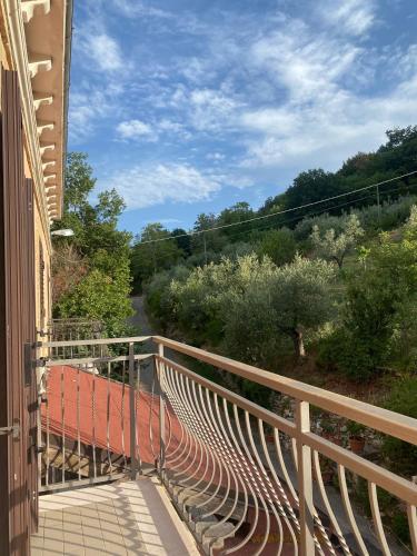 a balcony of a building with a view of a road at Casa contadina nel verde ai piedi della Majella - Agricasa Caprafico in Casoli