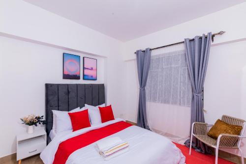 JKIA SGR Crystal Rivers 3BR with Pool and Mallにあるベッド