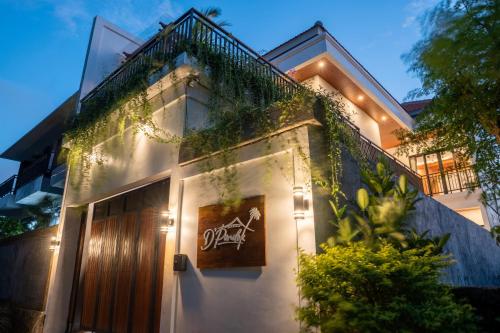 a building with a sign on the side of it at 3BR Brand New Cozy Private Villa D'Pondok Balangan in Uluwatu