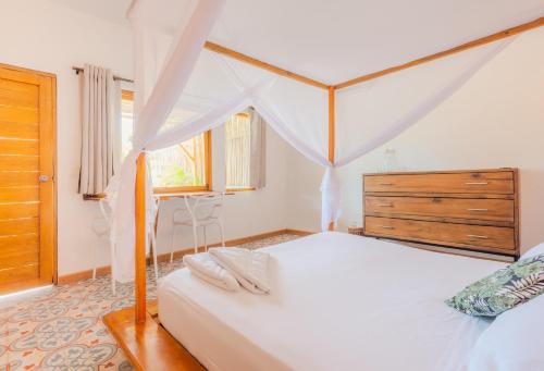 Postel nebo postele na pokoji v ubytování Casa del Pavo Real Boutique Hotel