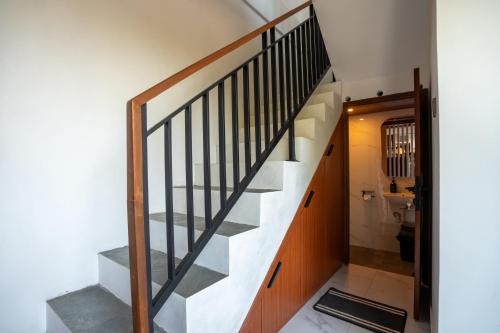 a staircase in a house with a bathroom at 3BR Brand New Cozy Private Villa D'Pondok Balangan in Uluwatu