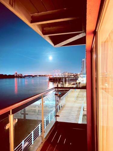 a view of a pier from a balcony of a ship at Amazing River view 2 bedroom apartment, sleeps 6 , balcony and parking in London