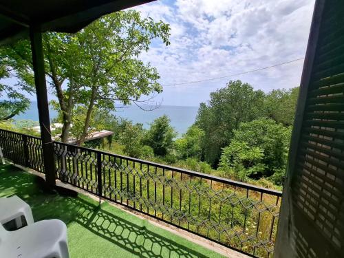 a view of the ocean from the balcony of a house at Bunaglows Panoramic Beach Village in Balchik